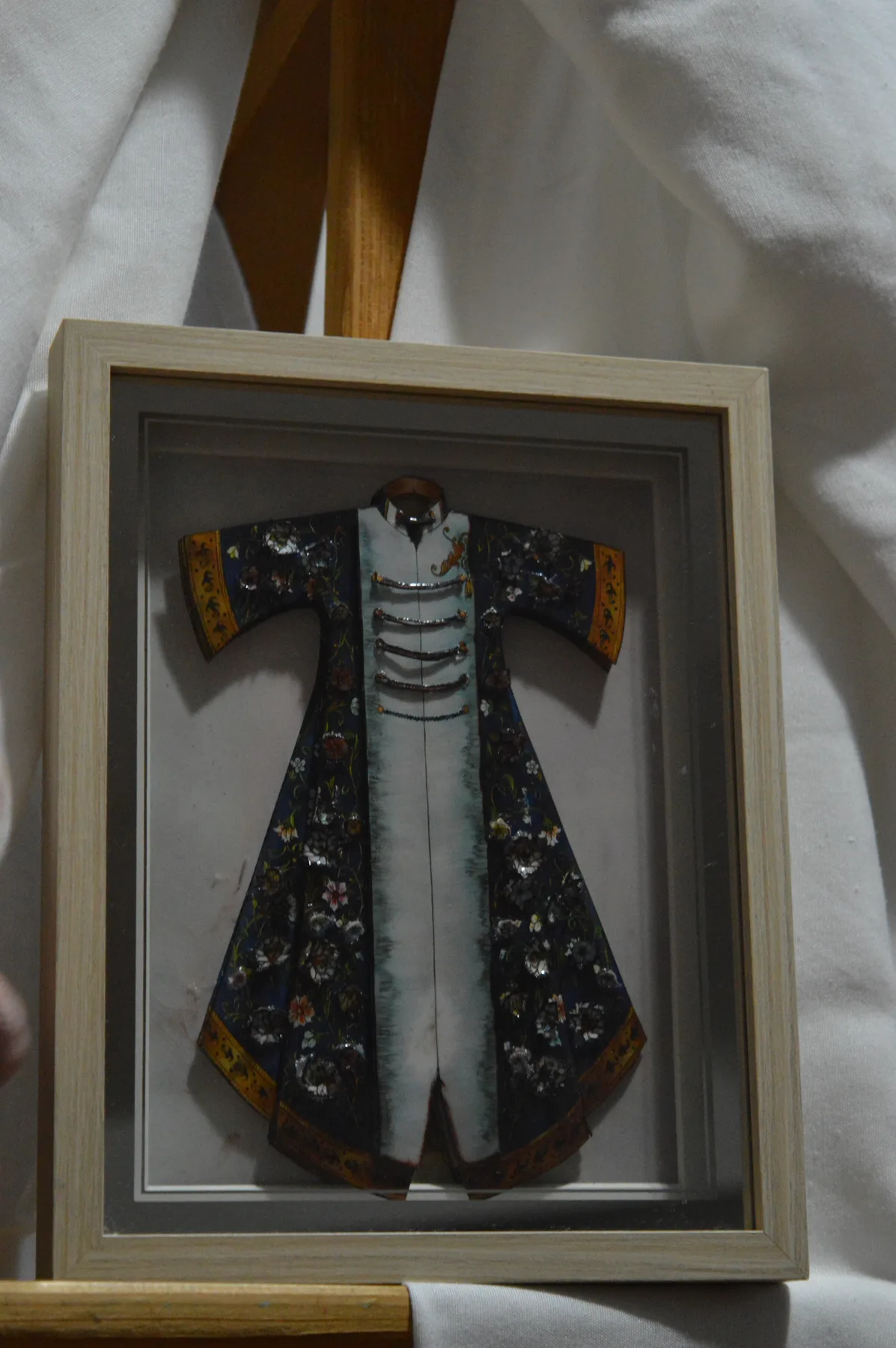 Detailed clothing paper relief tableau